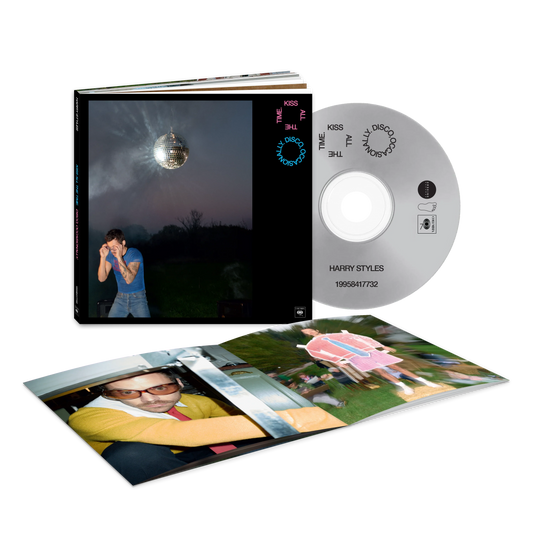 Harry Styles casebook CD collector's edition opened to show the disc, photo prints and album artwork