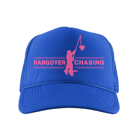 Royal blue Hangover Chasing trucker cap by Harry Styles with pink text and figure graphic