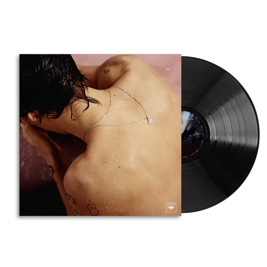 Harry Styles self-titled debut album cover with a black vinyl LP sliding out of the pink sleeve