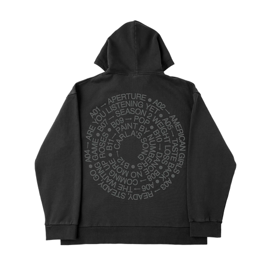 Back of black Harry Styles tracksuit zip-up jacket with reflective spiral tracklist print