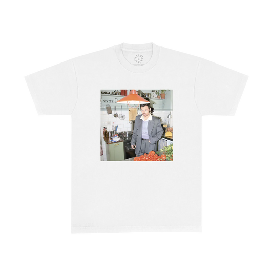 White Who Me graphic T-shirt by Harry Styles with a colour photo print of Harry seated indoors